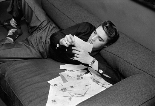 Alfred Wertheimer, Elvis at 21, Reading Fan Mail, Warwick Hotel, New York March 17, 1956.