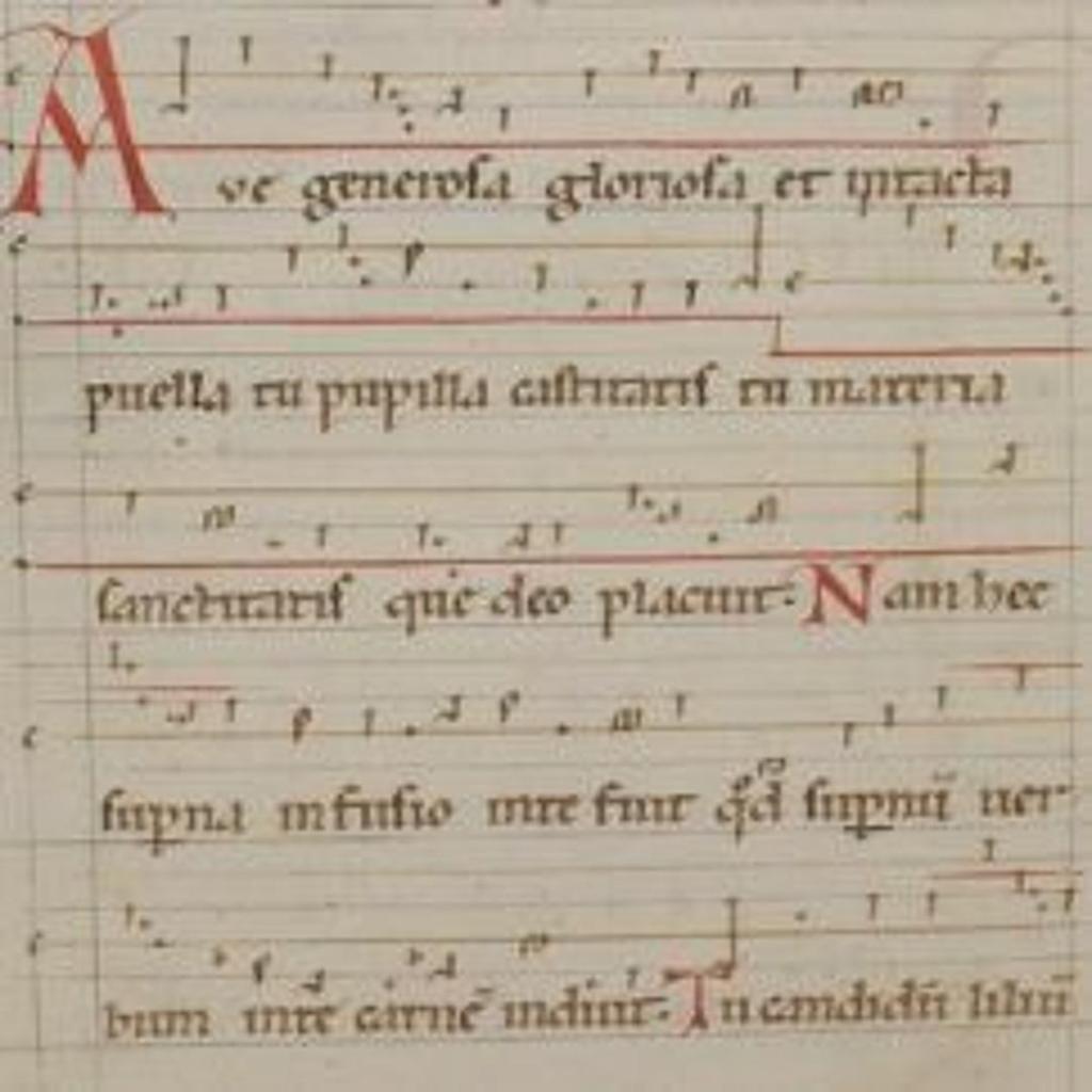 A page of medieval manuscript featuring ornate calligraphy and red ink embellishments, containing Latin text with musical notations.